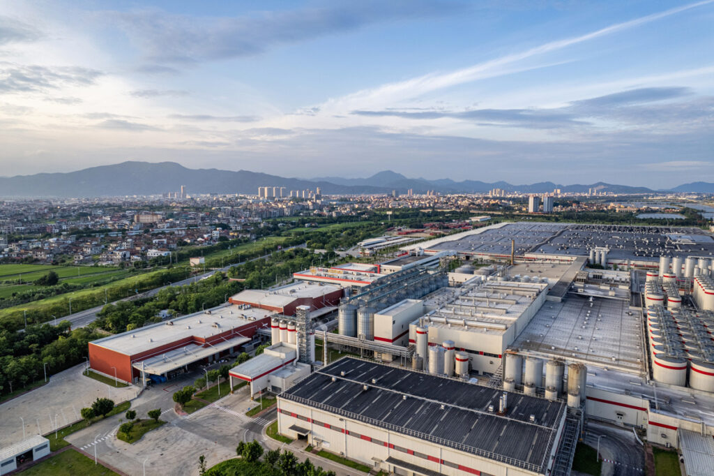 Industrial manufacturing building with skyline