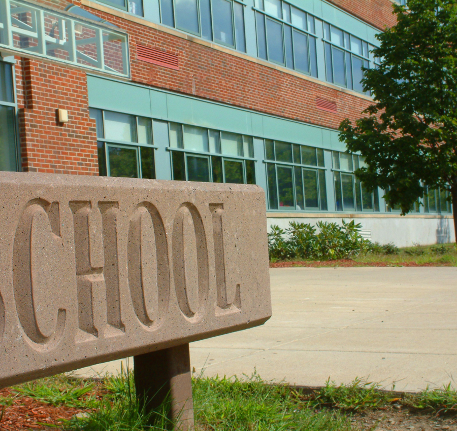 exterior of a school with green windows