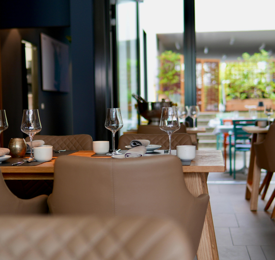 Interior of restaurant, tables with wine glasses
