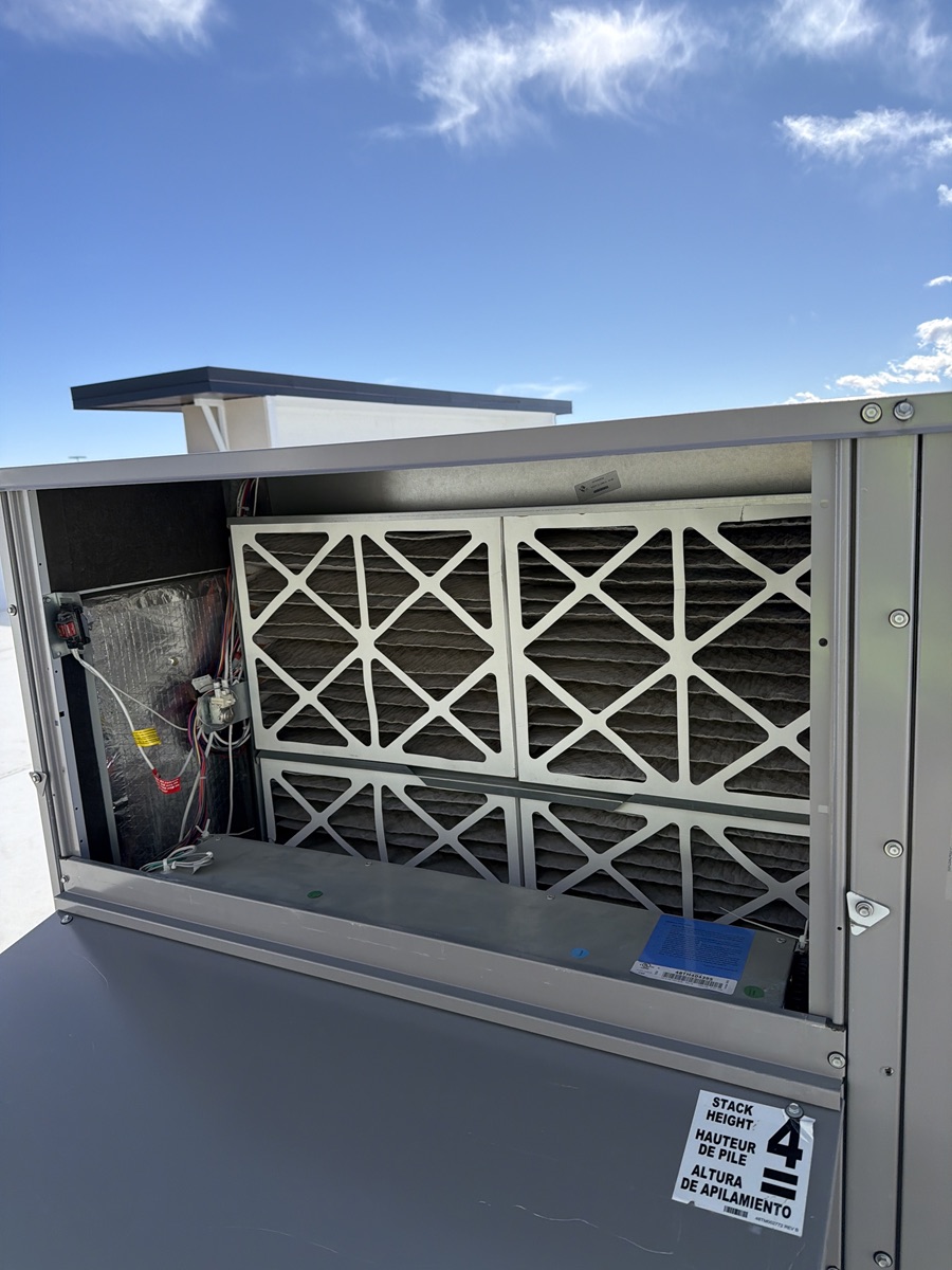 Clean rooftop air handler with filter exposed.