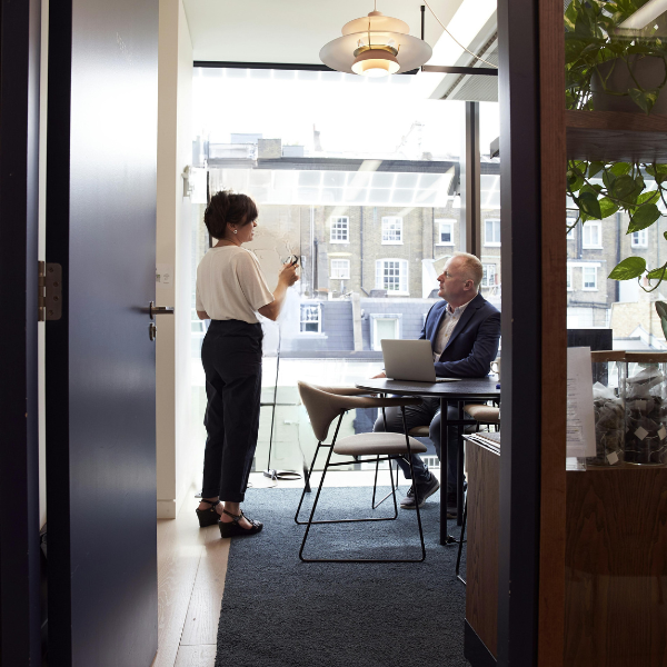 woman speaking to a man in an office